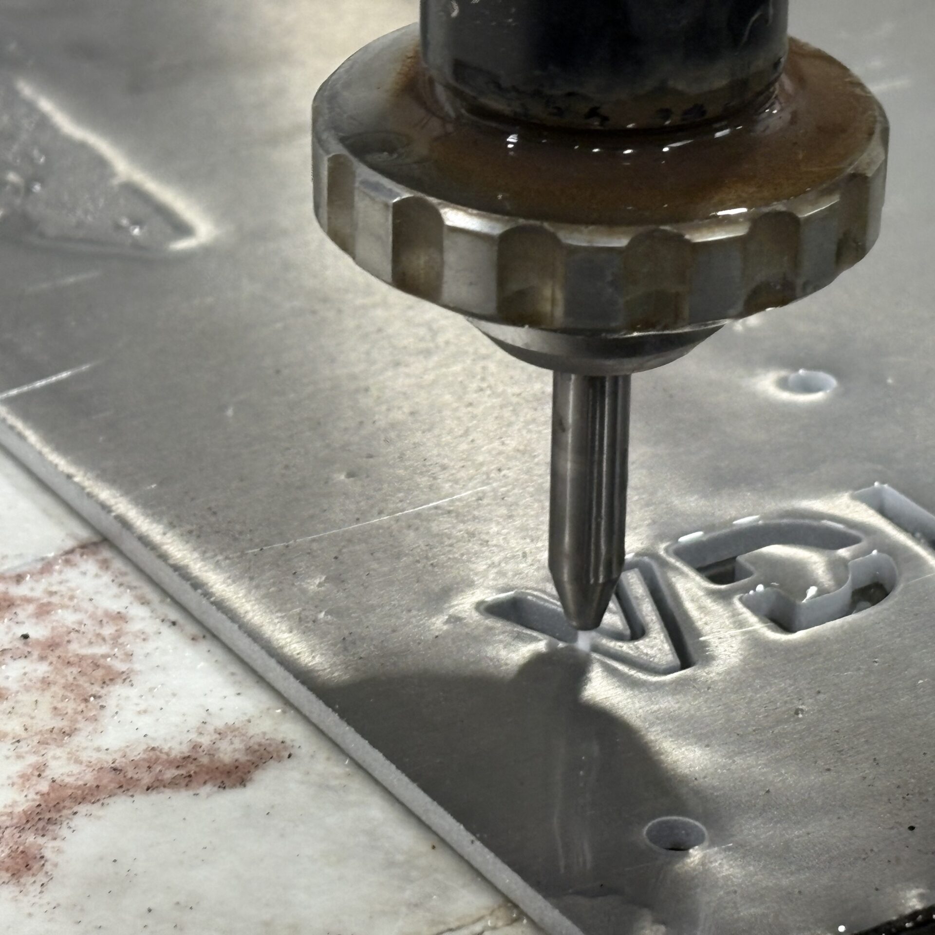 Water jet cutting a part in the Vandoit shop